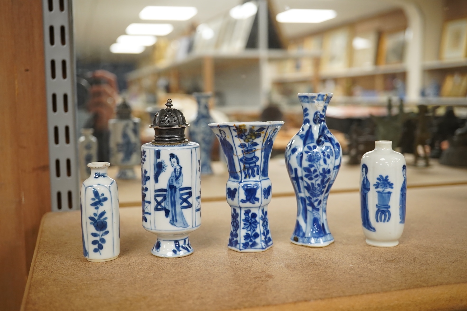 Five Chinese blue and white small vases, Kangxi period, one Dutch silver mounted as a sugar castor, tallest 11cm. Condition - varies